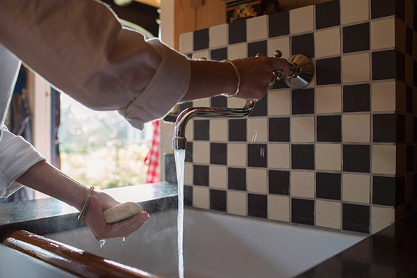 a person who uses hot water in their sink