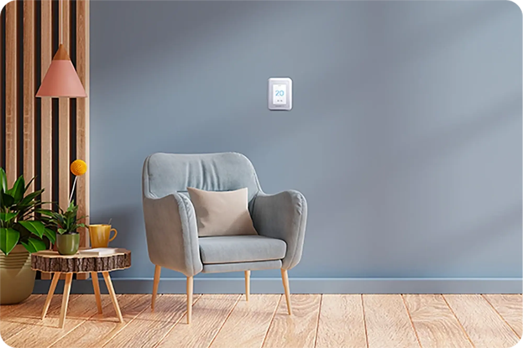 A gray armchair with a beige cushion and a small wooden table with plants and a pink lamp, in front of a blue wall where a Honeywell thermostat is mounted, displaying 20°C.